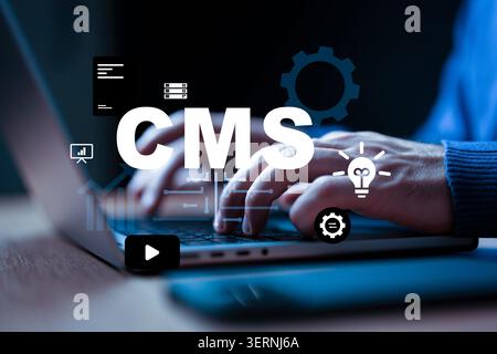 Using a content management system on a laptop for website development and management tasks Stock Photo