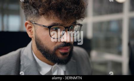 Portrait confident busy serious Arabian ethnic business man working concentrating job analyzing work task in office focused businessman boss ethnicity Stock Photo