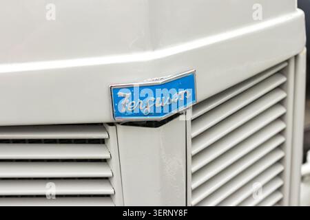Close up of the blue Ferguson logo badge on a vintage white farm tractor Stock Photo