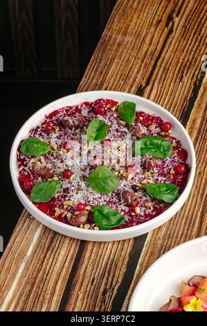 Gourmet beetroot carpaccio salad on a rustic wood table Stock Photo