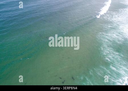 Drone perspective of clear turquoise sea with gentle waves The Concept of serenity and calmness Stock Photo