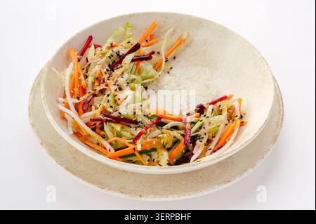 Half eaten colorful vegetable salad in a bowl Stock Photo