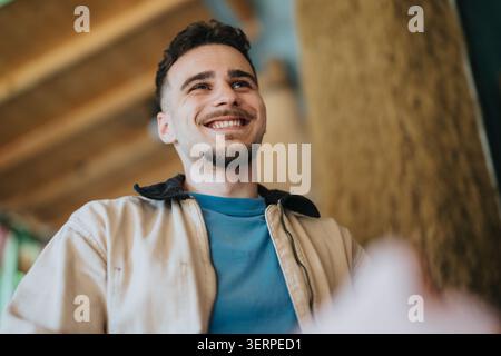 Smiling high school student looking up in a casual jacket and blue t-shirt Stock Photo
