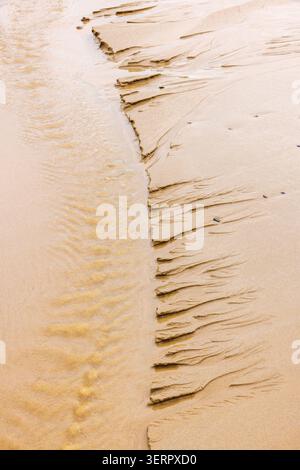 Pattern in the sand on a beach in low tide Stock Photo