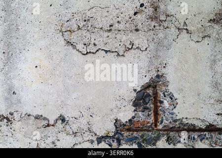 Decaying Concrete Wall Texture with Exposed Rusted Rebar Stock Photo