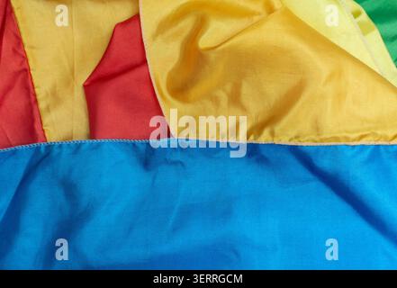 Colorful fabric texture with bright red, yellow, green, and blue colors, suitable for abstract background Stock Photo