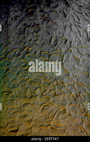 Abstract industrial plaster backdrop featuring a moody gradient texture with swirling waves and luxury golden lighting for creative design. Stock Photo