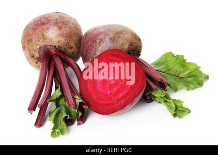 Whole and cut young beets with green leaves isolated on white Stock Photo