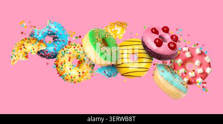 Tasty donuts and sprinkles falling on pink background Stock Photo