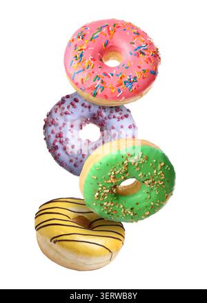 Yummy donuts covered with icing falling on white background Stock Photo