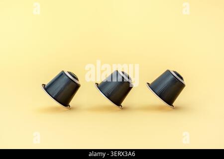 Espresso capsules on a yellow background Stock Photo
