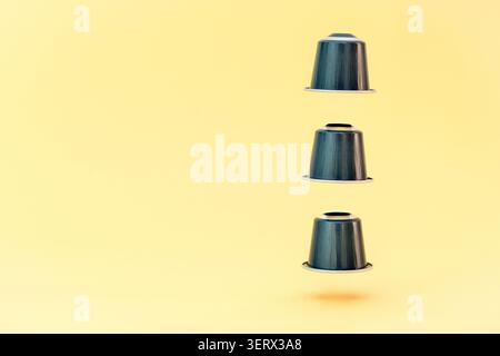 Espresso capsules on a yellow background Stock Photo