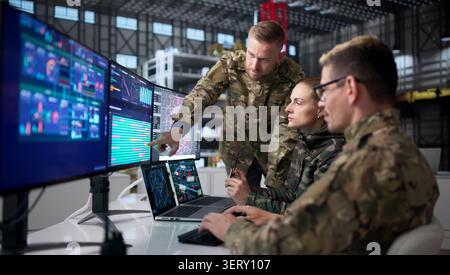 Engineers At Desktop Computers Develop Rocket Designs For Space Automation. Stock Photo
