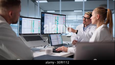 Medical Billing Team Works Together To Review Patient Invoices Accurately. Stock Photo