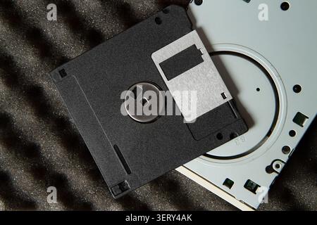 Computer floppy disk and floppy drive. Computer equipment close-up. Stock Photo