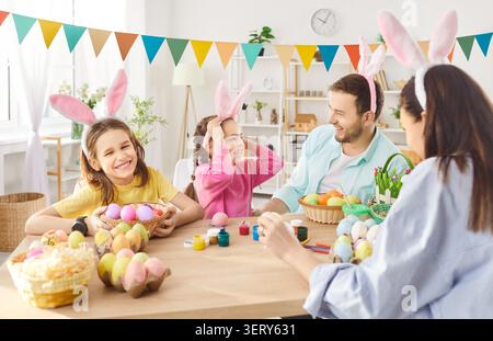 Happy family gather together for decorating Easter eggs Stock Photo
