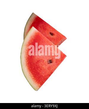 Front view of ripe red watermelon fruit in two pieces in stack is isolated on white background with clipping path. Stock Photo