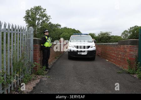 A police cordon near the scene just south of the Elstow interchange between the A421 and the A6 in Bedford South after two East Midlands Railway (EMR) trains were involved in a collision around 5.15pm on Friday. One person has died and a number of others are injured after two passenger trains collided near Bedford. Picture date: Saturday June 20, 2026. Stock Photo