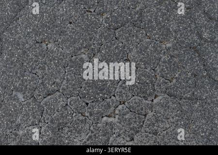 ABSTRACT BACKGROUND TEXTURE OLD CRACKED ASPHALT PAVEMENT Stock Photo