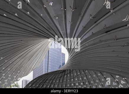 Chongqing, China - 8 Jun 2026 - a stylized architectural feature located outside The Ring Shopping Center in Chongqing, China. Overlapping metal panel Stock Photo