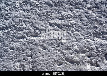 Background texture of wall with coarse white stucco or concrete Stock Photo