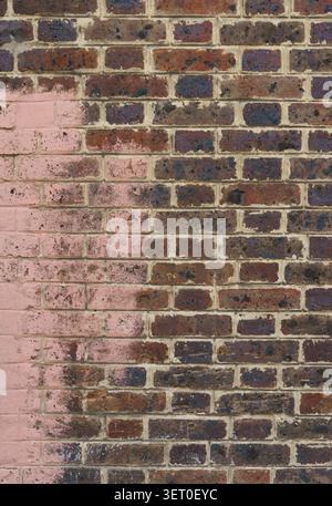 Brick wall with pink paint Stock Photo