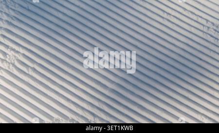 Freshly Groomed Corduroy Snow Pattern on a Ski Slope Stock Photo