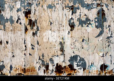 Grungy weathered wall texture with peeling paint Stock Photo