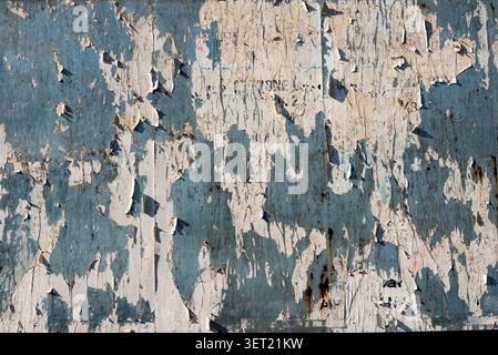 Distressed blue and beige peeling paint background Stock Photo