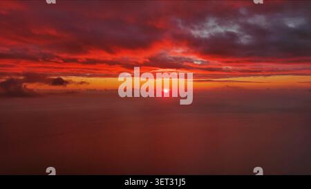 Sun setting over calm sea natural landscape Stock Photo