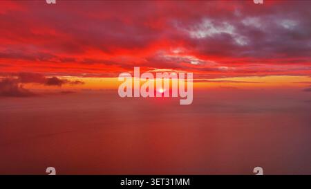 Sun setting over calm sea natural landscape Stock Photo