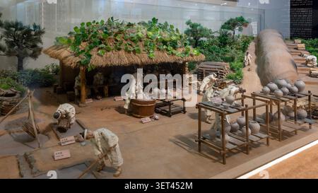 A miniature diorama depicting the traditional pottery-making process on display at the Gyeonggi Ceramic Museum in Gwangju, Gyeonggi-do, South Korea. Stock Photo