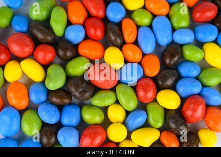 Multi coloured coated chocolate peanuts in red,blue,green,orange,yellow and dark brown colours Stock Photo