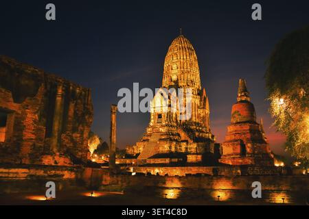 Wat Ratchaburana ancient temple in Ayutthaya Historical Park, Thailand .Towering central prang and crumbling brick ruins illuminated by warm golden li Stock Photo