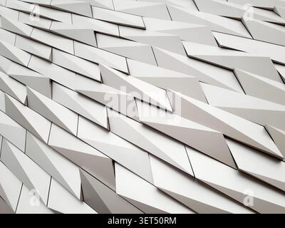 Abstract architectural detail of the reflective metallic exterior cladding on the Titanic Belfast building, Northern Ireland, United Kingdom. Stock Photo