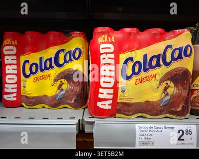 DENIA, SPAIN - January 23, 2026.Four plastic bottles of ColaCao Energy chocolate milk are on display in a supermarket in Spain. They are neatly arrang Stock Photo