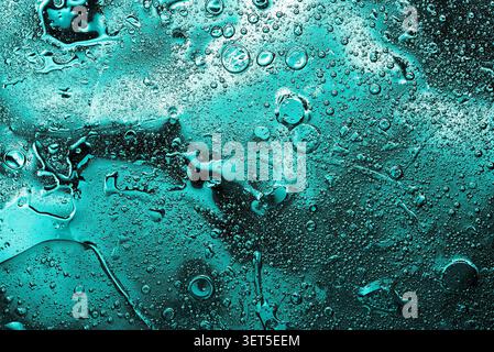 Dark turquoise fluid texture with organic bubbles and lines Stock Photo