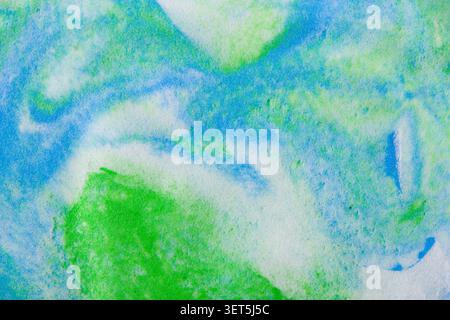 Fluid art presenting abstract blue, green, and white colors swirling together Stock Photo