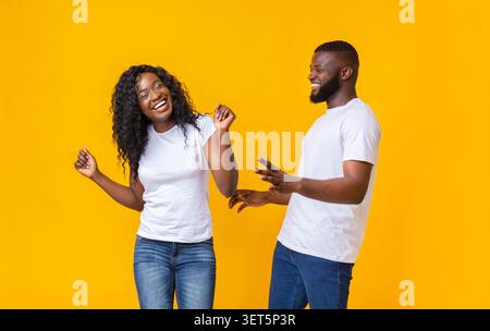 Lovely afro couple having good time with each other Stock Photo