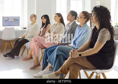 Attentive women team listening in business training, seminar and coaching session Stock Photo