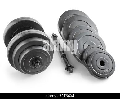 Dumbbells for fitness in assembled and disassembled form, with weight plates covered in plastic. Isloated on white Stock Photo