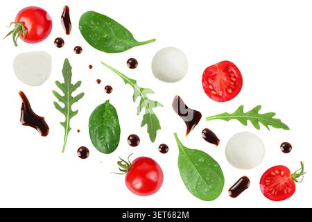 Mix salad - arugula, spinach, chard, cherry tomatoes and mozzarella isolated on white background. Top view. Flat lay Stock Photo