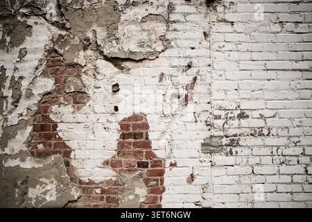 Weathered brick wall and peeling paint Stock Photo