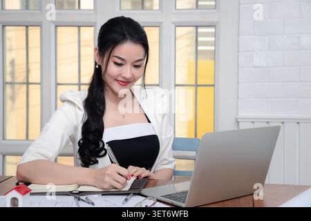 Architect engineer contractor design working drawing sketch plan blueprint and making architectural construction house building. Stock Photo
