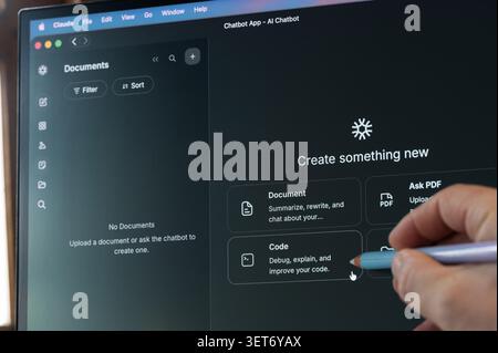 New York, USA - June 16, 2026: Creating code project in Cloude AI app close up view on screen background Stock Photo