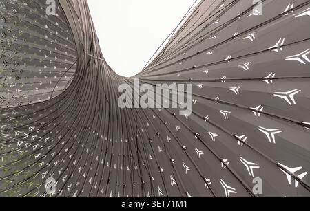Chongqing, China - 8 Jun 2026 - The composition of dominated by a sweeping arrangement of metallic, monochromatic ribs that converge and fan outward w Stock Photo