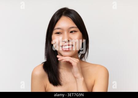 Smiling Young Asian Woman Touching Chin And Looking At Camera, Weight Loss Concept Stock Photo