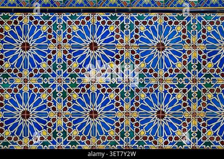 Ceramic tiles with geometric patterns in blue and yellow. Stock Photo