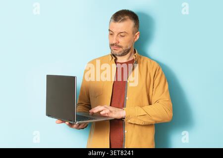 Man Using Laptop In Office, Focused On Work, Business Concept Stock Photo