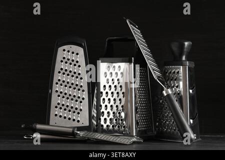Assortment of stainless steel kitchen graters and zesters for food preparation and culinary tasks, these essential culinary tools are used for various Stock Photo
